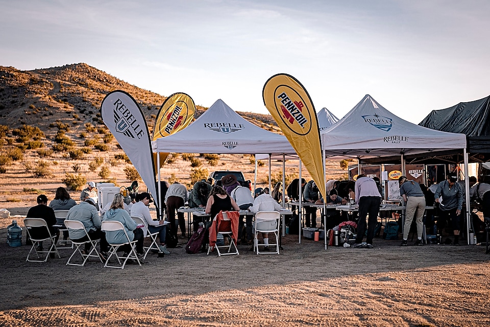 REBELLE U PARTICIPANTS GATHER UNDER TENTS FOR HANDS-ON TRAINING